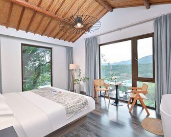 Nanjing Yuequnqing·Thai style Tangquan Holiday Homestay - Nanjing - Schlafzimmer