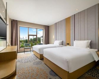 Lavande Hotel Rizhao East Haiqu Road Rt-Mart - Rizhao - Ložnice