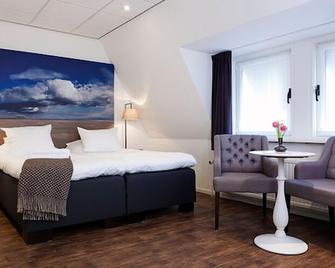 Boutique Hotel De Smulpot - Den Burg - Camera da letto