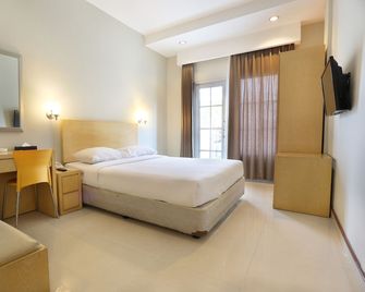 Triniti Hotel Batam - באטאם קוטה - חדר שינה