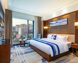 Quanzhou Jinjiang International Airport Siji Garden Hotel (Baolong Plaza) - Quanzhou - Schlafzimmer