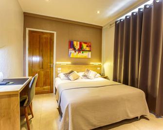 Q-Inn Boutique Hotel - Paramaribo - Schlafzimmer