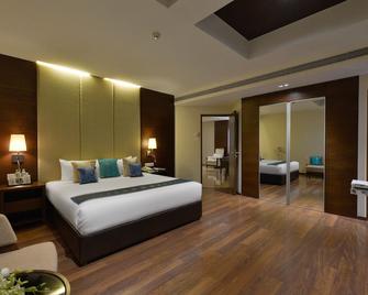 Grand Mercure Vadodara Surya Palace - ואדודרה - חדר שינה
