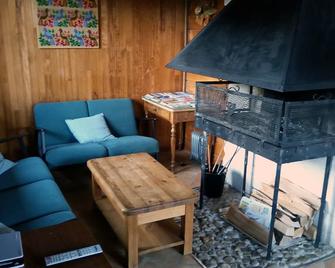 Detached chalet, very well located in a very quiet set of 29 chalets. - Lamoura - Living room