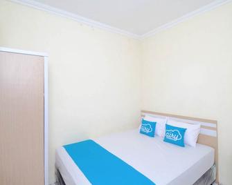 Airy Eco Papringan Ambarrukmo Ori Dua 7 Yogyakarta - Depok - Bedroom