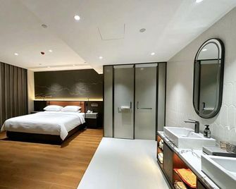 Leshuihui Hot Spring Hotel - Daqing - Bedroom