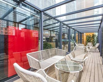 Qiu Guo Hotel (Beijing Huamao) - Pekín - Balcón