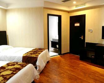 Xiaoding Business Hotel - Liangshan - Bedroom