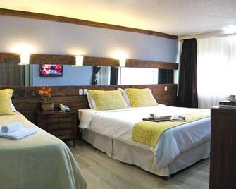 Sky Centro Hotel & Spa - גרמאדו - חדר שינה