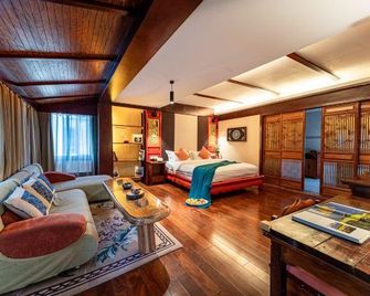 Yixing Thatched Cottage Inn (Lijiang Old Town Dashuiche Branch) - Lijiang - Bedroom