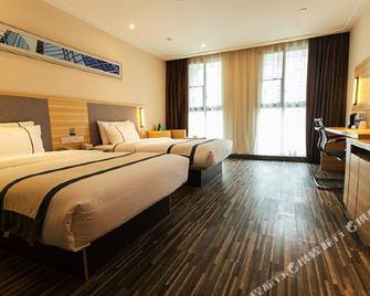 CC Inn (Zigong Wanda Plaza) - Zigong - Bedroom