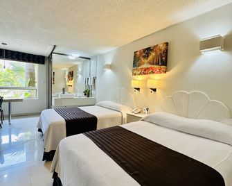 Hotel Plaza Caribe - קנקון - חדר שינה