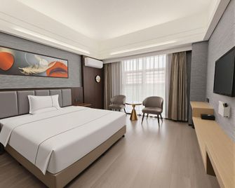 Xiang De V Hotel - Ťing-čou - Ložnice