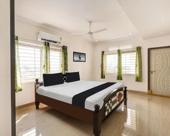 Super Hotel O Ramaraopet Near Kakinada Beach - Kakinada - Schlafzimmer