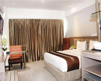 Claro Hotel Kendari - Kendari - Schlafzimmer