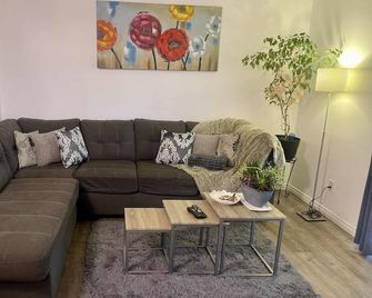 Cozy Condo-Your Home Away from Home, 2BR (1KB-1QB) Parking in front of the door! - Grande Prairie - Living room