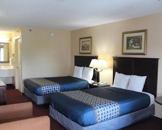 Carom Inn a Travelodge by Wyndham Denham Springs/Baton Rouge - Denham Springs - Bedroom