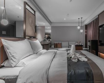 Qingdao Treasure Hotel - צ'ינגדאו - חדר שינה
