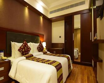 Classic Sarovar Portico Thiruvananthapuram - טריבאנדרום - חדר שינה