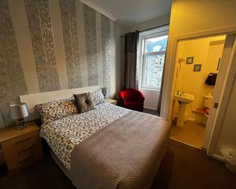 Dunarle Guesthouse - אובן - חדר שינה