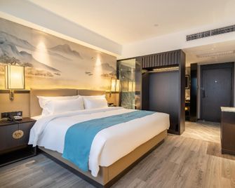 Rezen Dong Hotel(Huzhou City Center High-speed Railway Station Store) - Huzhou - Slaapkamer