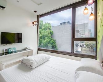 lightness Station Inn - Tainan - Schlafzimmer