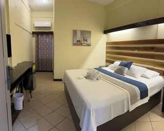 Sky Inn - Caye Caulker - Schlafzimmer
