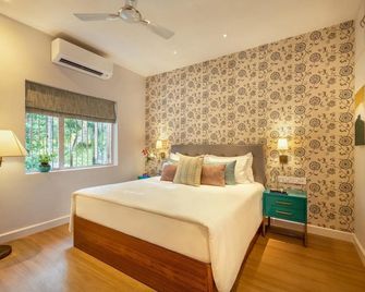 ama Stays & Trails Braganza House - Candolim - Schlafzimmer