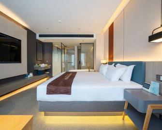 Dongfang Yijing Hotel - Lishui - Schlafzimmer