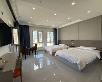 Qishuyuan Boutique Homestay (Harbin University Town Branch) - Harbin - Bedroom
