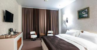 City Hotel - Wolgograd - Schlafzimmer