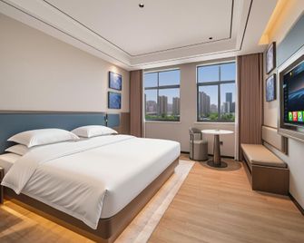 Shangqiu Yuanyang Boutique Hotel (Shangqiu Institute of Technology) - Shangqiu - Slaapkamer