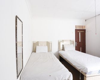 Hotel O Penginapan Budhe Sri - Samarinda - Ložnice