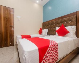Hotel O Greenforest Near Airport Road Metro Station - Mumbai - Bedroom