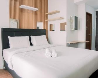 Simply Look Studio at Amazana Serpong Apartment By Travelio - Tangerang City - Camera da letto