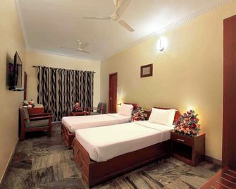 Hotel Indraprastha Karunagapally - Kollam - Camera da letto