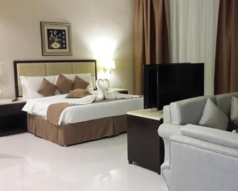 Grand East Hotel - Resort & Spa Dead Sea - סוויימה - חדר שינה