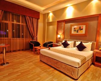 فندق الجفير جراند هوتل - المنامة - غرفة نوم