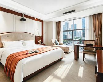 Gandong Hotel (Fuzhou Wenchangli Vientiane Sky Curtain Plaza Branch) - Fuzhou - Bedroom