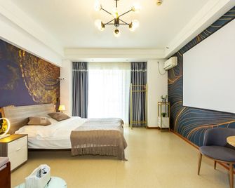 Hong Xiyuan Apartment Hotel Wada Plaza - Dalian - Habitación