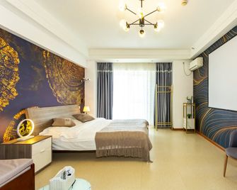 Hong Xiyuan Apartment Hotel Wada Plaza - Dalian - Bedroom