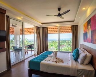 Aadisaktthi Leisure Resort, Kovalam - Kovalam - Schlafzimmer