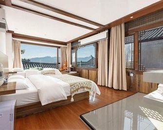 Yang · Wonderland Inn - Lijiang - Bedroom