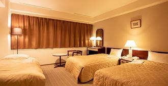 Hotel Sunroute Matsuyama - מאטסויאמה - חדר שינה
