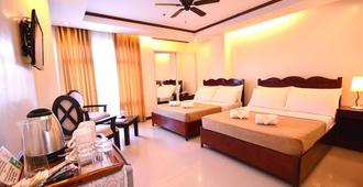 Ipil Suites Puerto Princesa - Puerto Princesa - Schlafzimmer