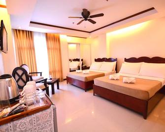 Ipil Suites Puerto Princesa - פוארטו פרינססה סיטי - חדר שינה