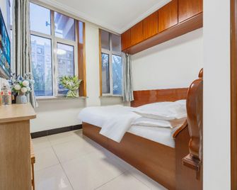 Qingqing Hotel (Dalian Huanan Square Branch) - Dalian - Bedroom