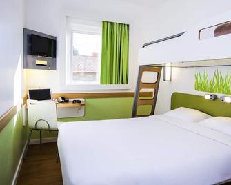First Inn Hotel - Apt - Schlafzimmer