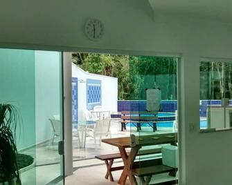 Beautiful townhouse with air conditioning, swimming pool and independent hot tub - Bertioga - Patio