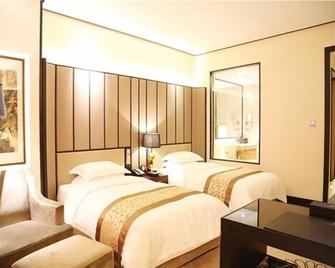 Jiuhua Jin Jiang International Hotel - Zhenjiang - Schlafzimmer